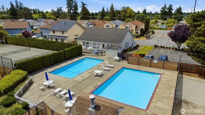 Resort-style community amenities: two pools, clubhouse, and sport court just steps from your door.