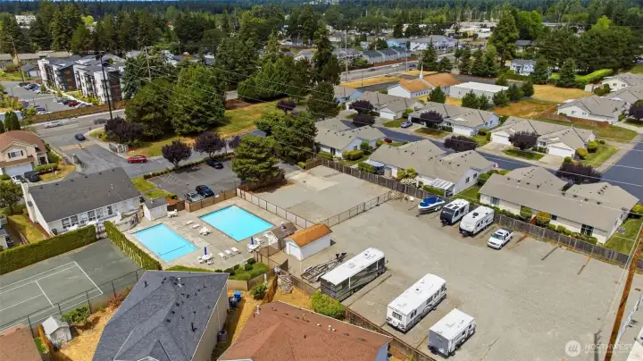 Bird's-eye view of Country Place — quiet, established community with RV/boat parking and quick access to shopping, dining, and JBLM.