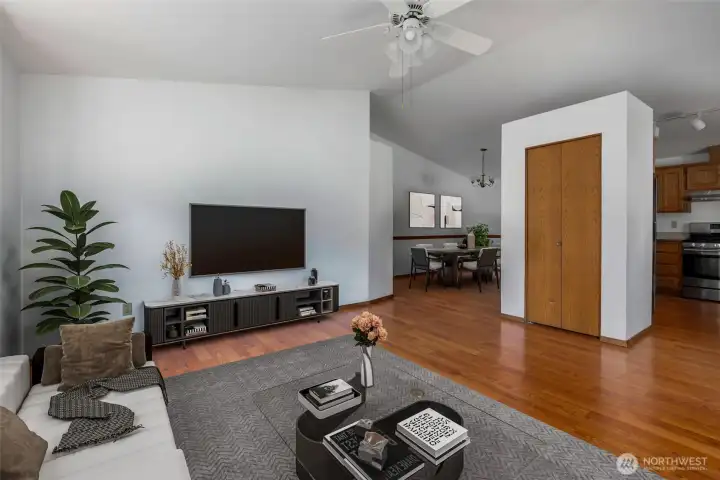 Living Room virtually staged with view to dining room and kitchen
