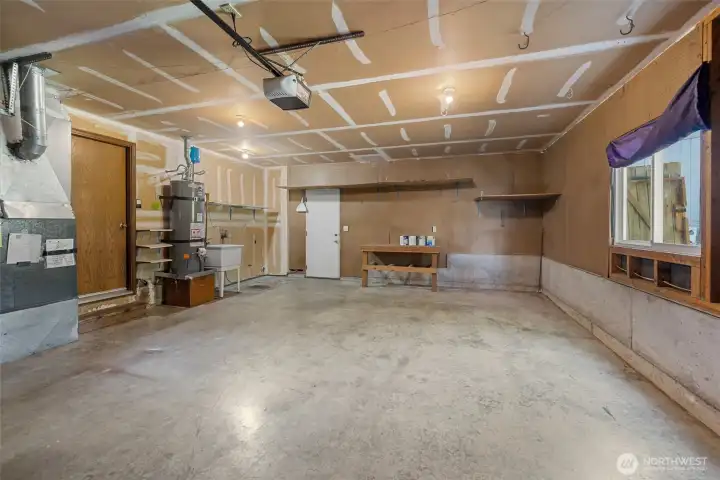 Nice size 2 car garage with newer gas furnace and hot water heater.  Washer/Dryer hookups located next to hot water tank.  Access to back yard from garage.