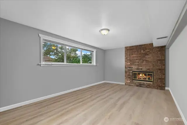 Secondary living room and fireplace on the lower level