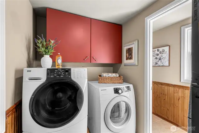 Lower level laundry room with adjacent  1/4  bathroom.