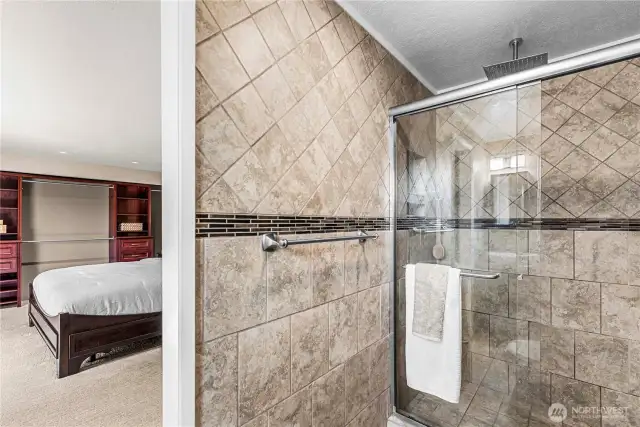 Beautifully tiled, primary bathroom.