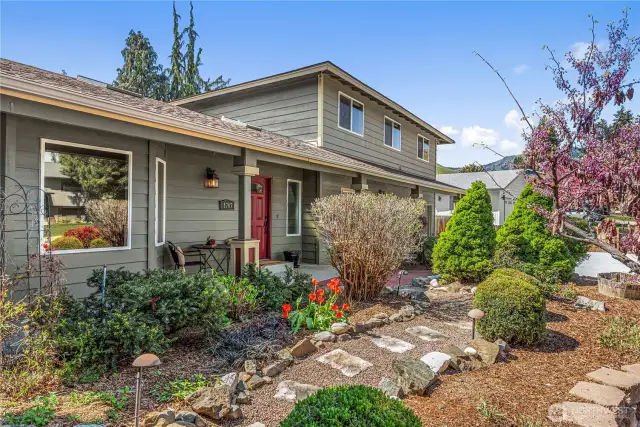 Well-maintained front yard with mature landscaping.