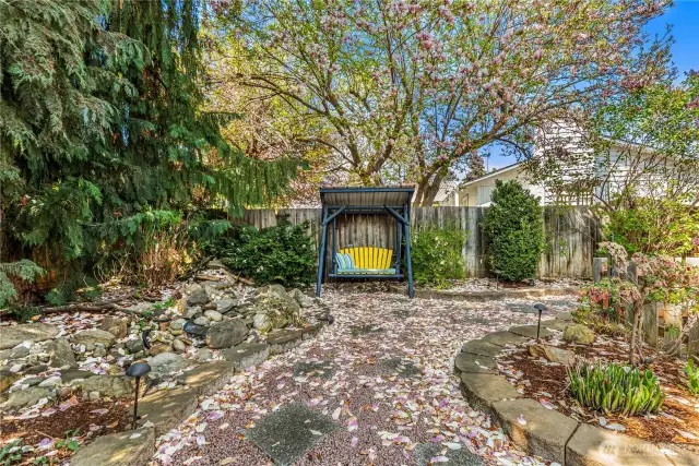 Thoughtfully landscaped backyard with a peaceful setting.