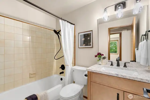 Tastefully updated main hall bath.