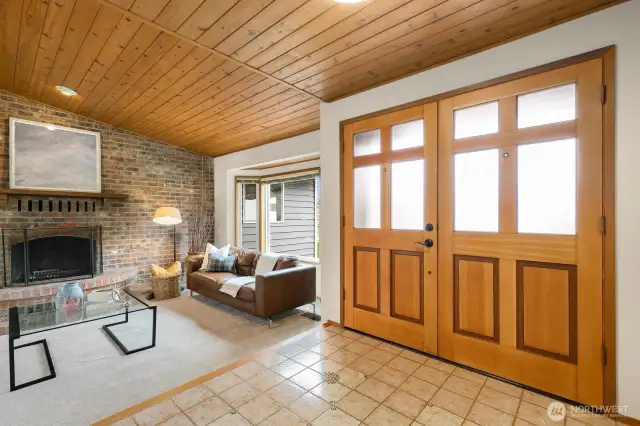 Welcome home! Stunning, vaulted, wood-lined ceilings and look at that door!