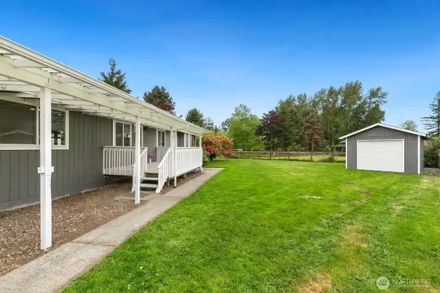 Back yard shed / 1 car garage offers ample storage space.
