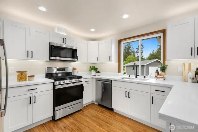 Brand new cabinets, quartz counters and appliances! Plus over and under mount lighting.