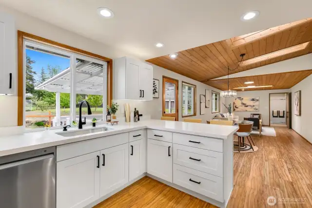 Great working space opens to dining and family room, all overlooking the peaceful backyard.