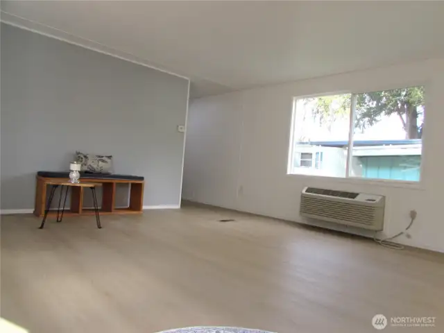 LIVING ROOM AS YOU ENTER, BUILT-IN A/C WALL UNIT.