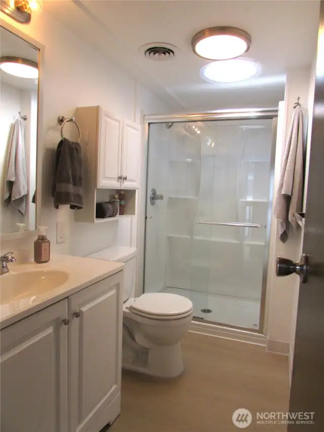 BATHROOM HAS BEEN UPDATED W/ WALK IN SHOWER & VANITY, SKYLIGHT ADDED FOR LIGHTING.
