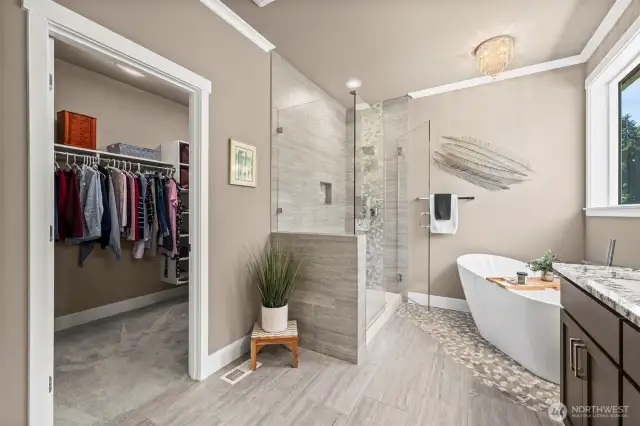 This is a spacious walk-in closet for his and hers!