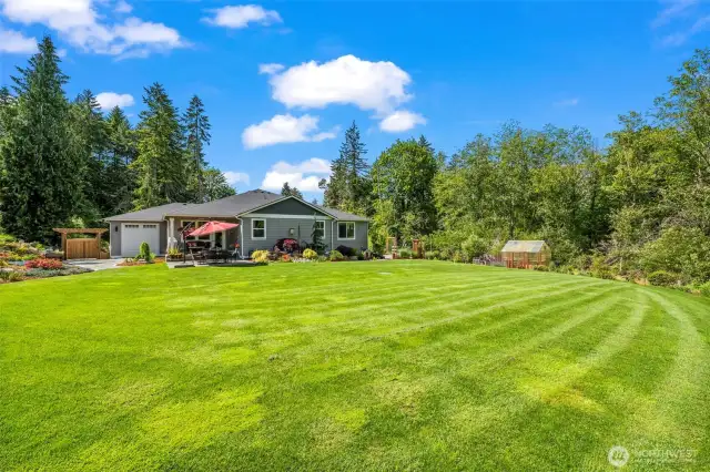 This level backyard is waiting for YOU - lots of grass to play in for your kids or grandkids!