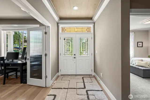 Welcome in!  Wood ceiling in the foyer add a special touch, along with a double leaded-glass door.   To the left is the office, to the right is Bedroom #3.