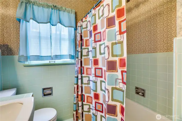 Step back into the charm of yesteryear with a tile tub surround, classic tile floors and countertops.