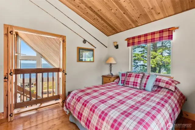 Bifold doors allow for the bay views from the bedroom
