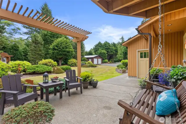 Covered patio with swing seat, custom furnishings, pergola