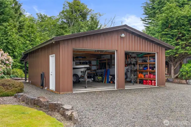 Additional 2 stall garage. 26’ x 30’ 29 - gauge colored steel chestnut brown metal building with classic brown metal roof, 8’ x 26’ covered cement porch with recessed lighting  Cement floors  Shelving and work benches  10’ x 10’ raised panel Wayne Dalton overhead doors  Steel solid core entry doors  Indoor and outdoor lighting - LED dusk to dawn light