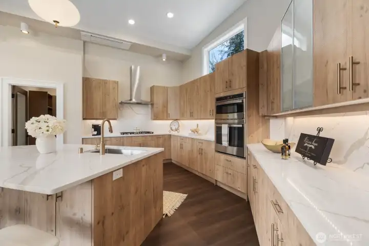 Gourmet chef's kitchen is fully equipped with top of the line appliances