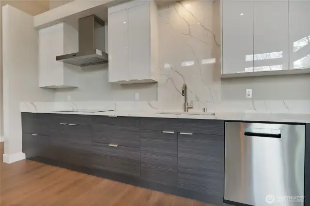 Stainless Steel Under-mount Sink • Upgraded Wine Fridge • Electric Cooktop • Stainless Steel Appliances