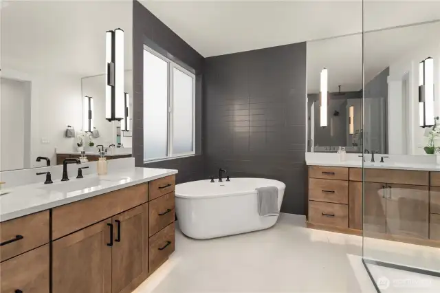 A Stand alone Soaking Tub is companioned with an increble large Tiled Walk-in Shower complet with Rainhead and other components.