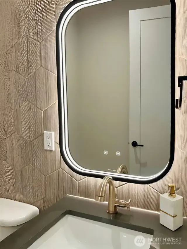More Tech lighting in the Powderroom around the modern Mirror.
