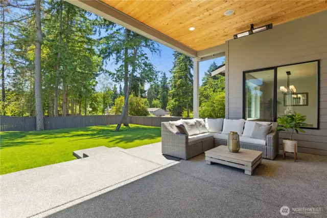 This Large Covered Patio area is located off the great room through a Dbl Doo Slider adjacent to the Gourmet Kitchen.