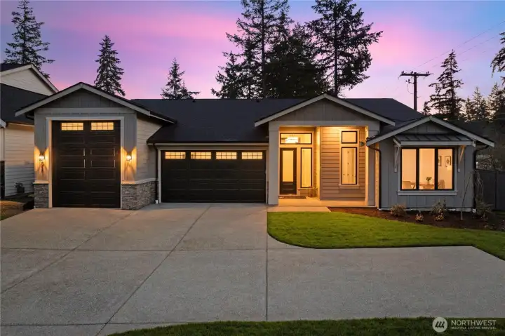 This elegant single-level home features an abundance of parking both inside and out.