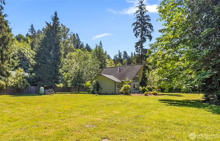 Huge, open, sunny yard, ready for play, garden, entertaining in style.