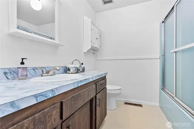 2nd full bath with the cool blue retro look.