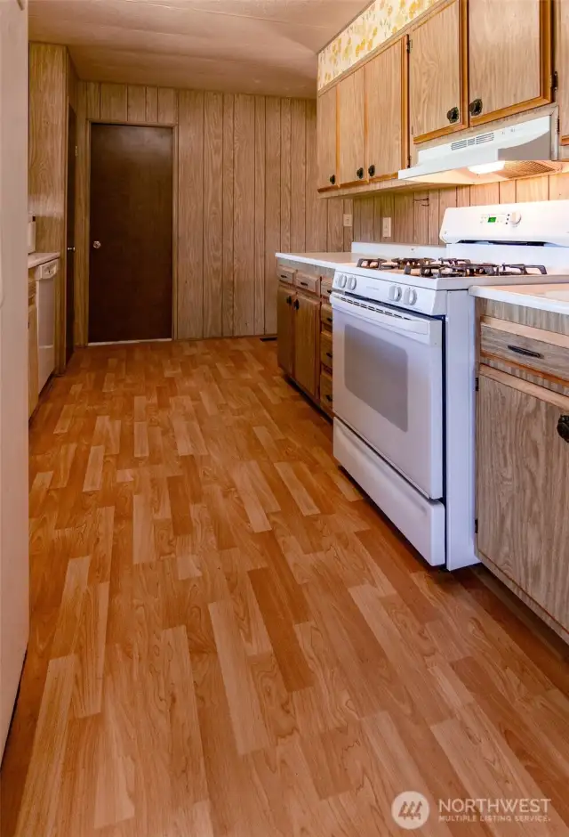 The door at the end is the mud/laundry room.