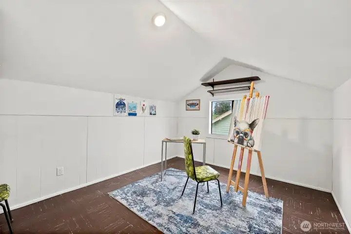 Room with vaulted ceiling and abundant natural light.