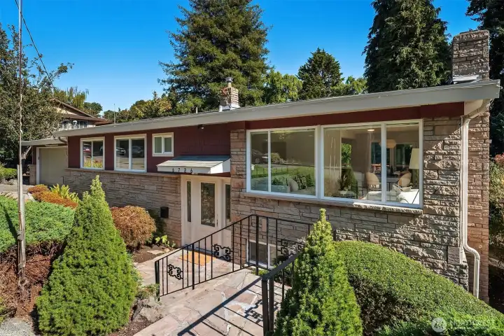 Well maintained mid-century home with attached 2 car garage sited on a 1/4 acre lot.