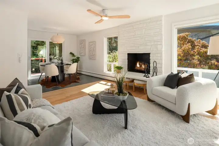 Living room adjacent to ding room with access to backyard deck.