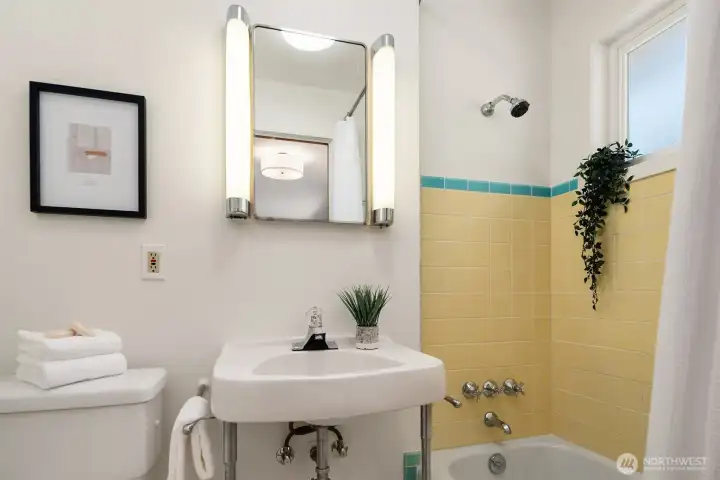 En-suite full bathroom with retro tile.