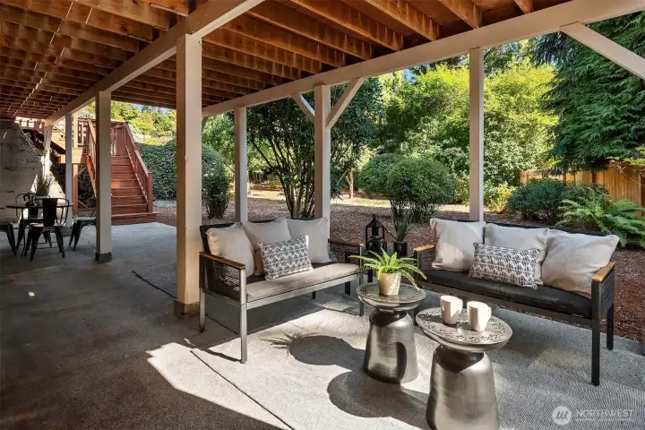 The lower level patio runs the entire length of the home.