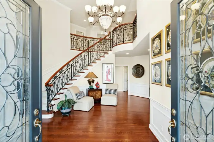 A grand entry welcomes you with timeless elegance, highlighted by custom-designed ironwork railing.