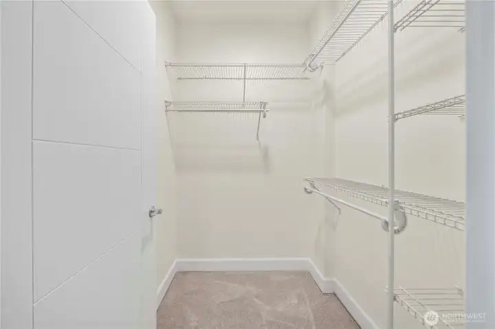 The spacious walk-in closet in Secondary Bedroom provides generous shelving and hanging storage, keeping everything organized and easily accessible. Its thoughtful layout maximizes square footage and supports a clutter-free living experience.