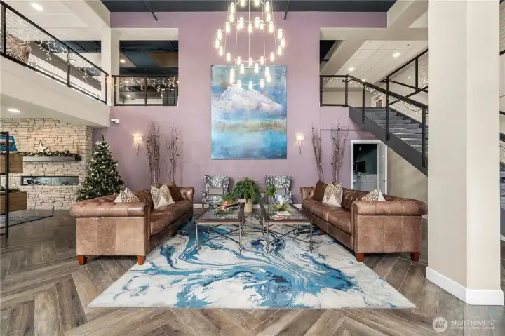 The grand lobby showcases soaring ceilings, elegant lighting, and beautifully styled seating areas. Its upscale design and welcoming ambiance set the tone for the refined living experience this community offers.