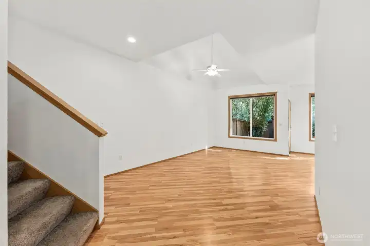 Carpeted staircase off living room walkway leads up to all 3 upstairs bedrooms.