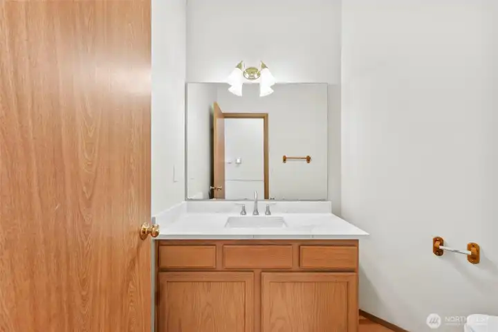 Main floor half bathroom next to the utility room