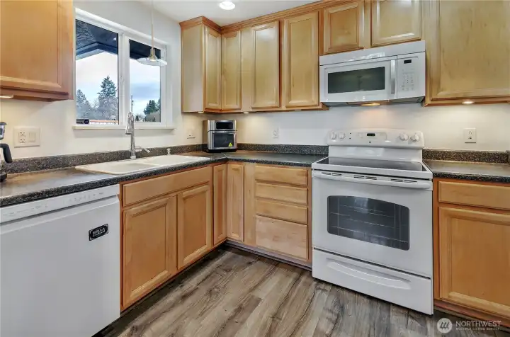 Sink overlooks backyard to the north, newer appliances and LVP flooring gives you peace of mind.