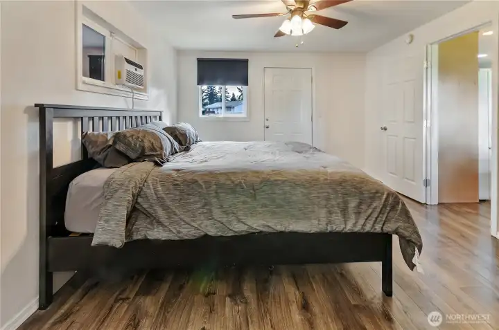 Primary Suite looks out to backyard and has its' own entrance and egress to patio.