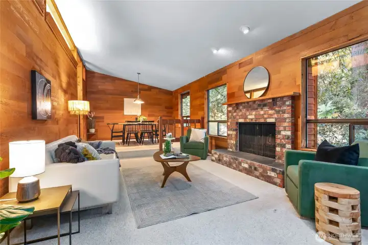 Living room with vaulted ceilings and fireplace