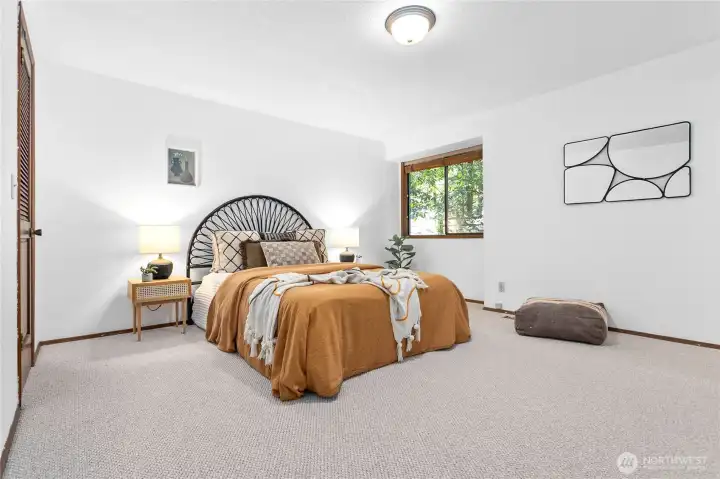 Primary bedroom with new carpet.