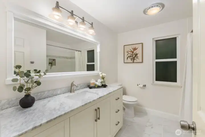 Guest bathroom with new tile and vanity