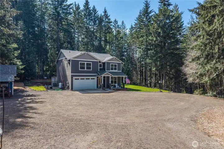 TONS of parking - Large gravel driveway plenty of space for RV, boat and all your toys or hosting large parties. Concrete pad leads to the 2-car garage. Plenty of turnaround space.