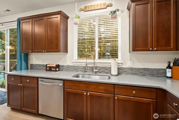 Views of the backyard while you work in front of the sink. Dishwasher located to the left of sink.