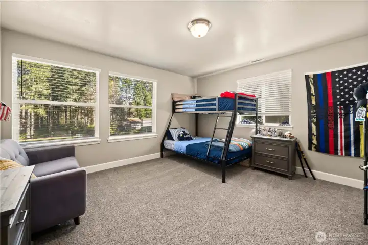 Large bedroom 3 with plenty of natural light from the large windows.
